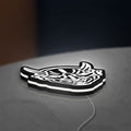Japanese Hannya Mask LED lightbox lying flat on a desk with white glow