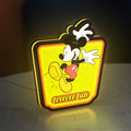 Mickey Mouse LED lightbox standing on a desk from an angled side view with yellow glow
