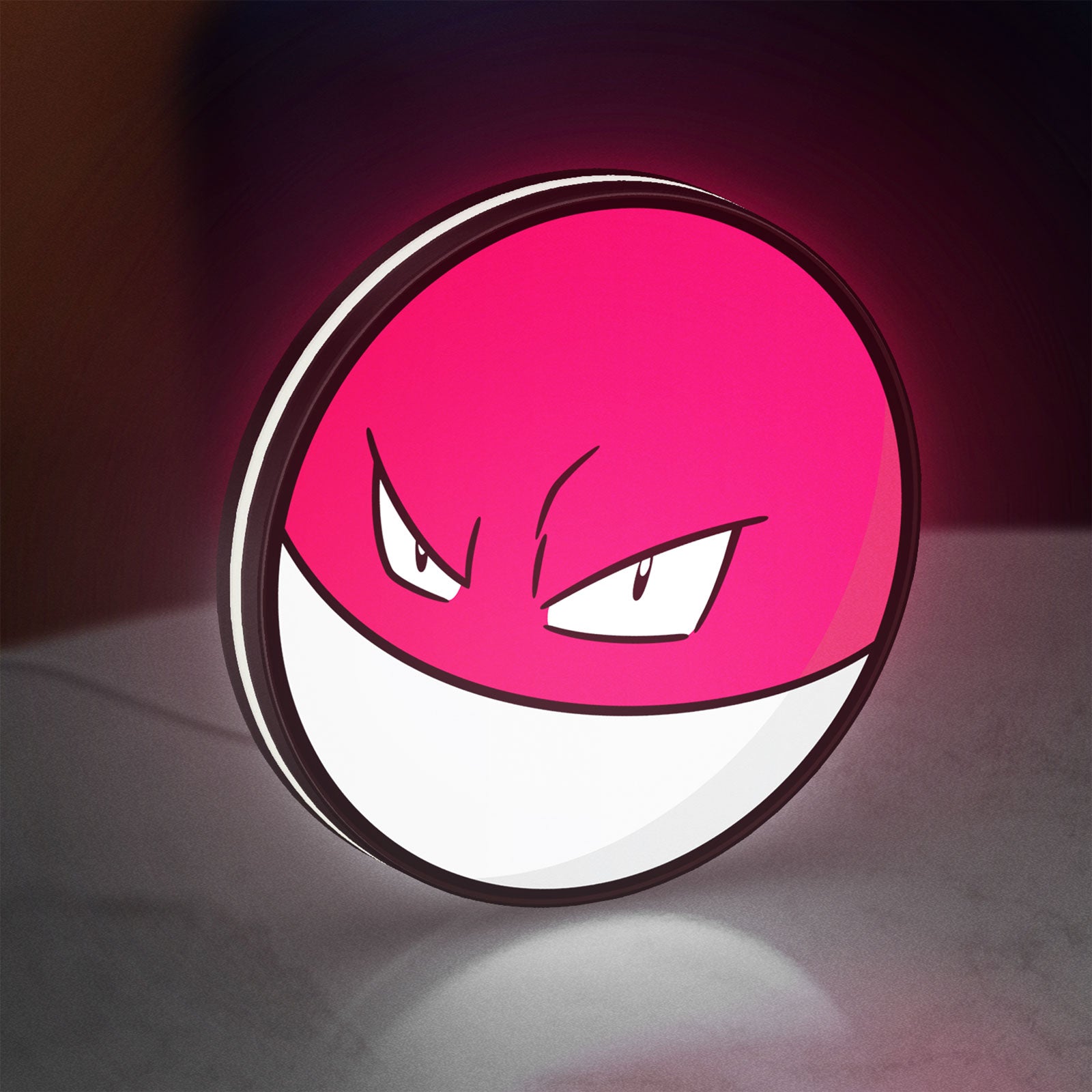 Voltorb LED lightbox standing on a desk from an angled side view with white glow