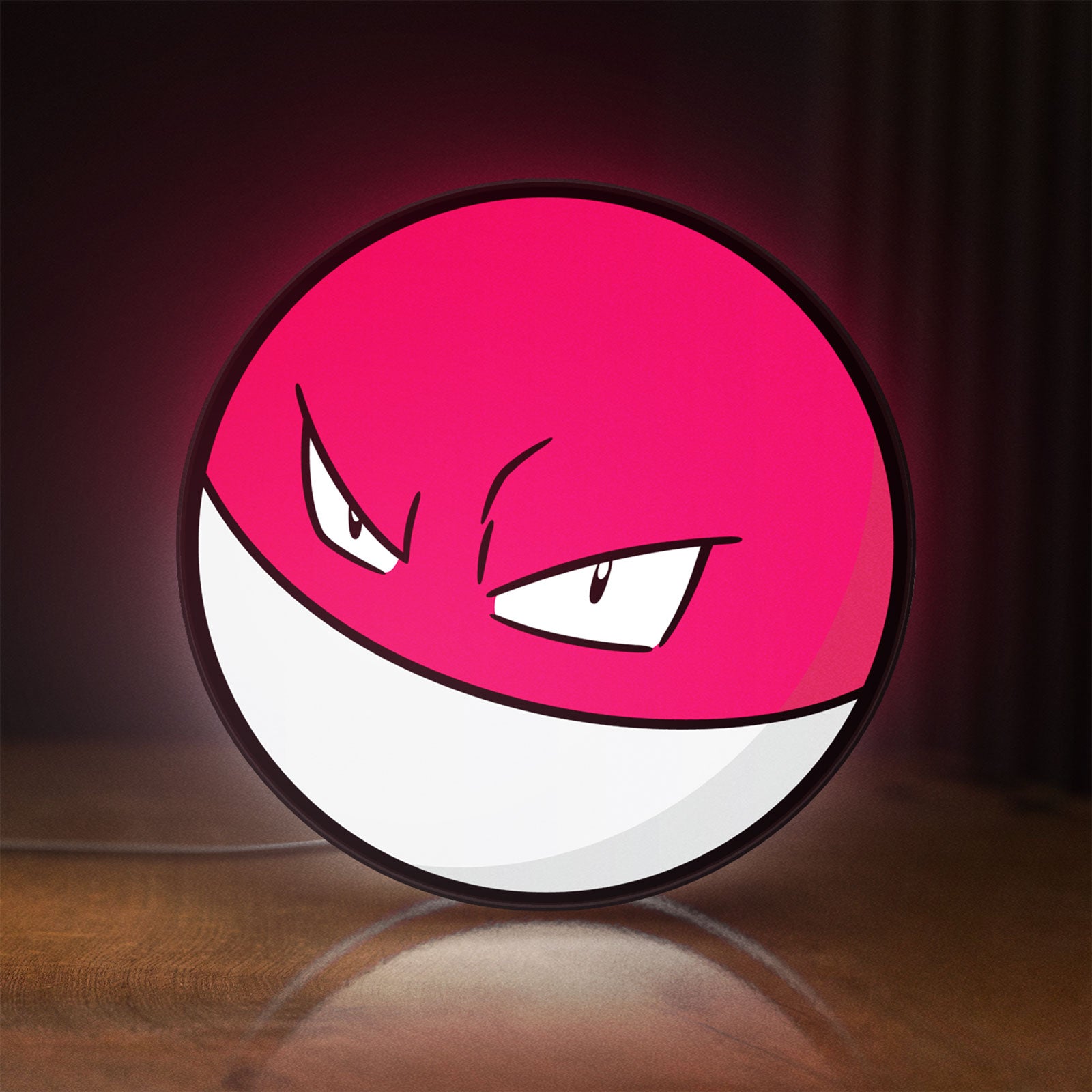 Front view of Voltorb LED lightbox sign glowing on a wooden desk