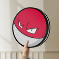 Unlit Voltorb LED lightbox held by hand to show size and details