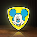 Front view of Mickey Mouse LED lightbox sign glowing on a wooden desk