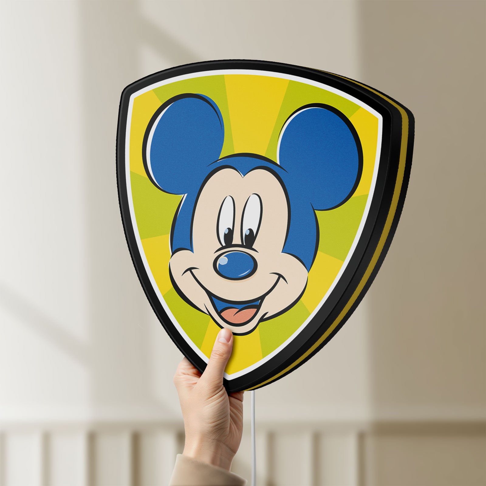 Unlit Mickey Mouse LED lightbox held by hand to show size and details