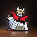 Front view of Mazinger Z LED lightbox sign glowing on a wooden desk
