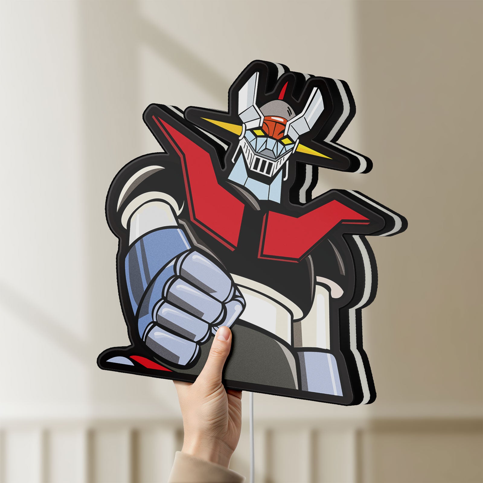 Unlit Mazinger Z LED lightbox held by hand to show size and details