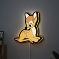 Bambi LED lightbox hanging on a wall with yellow glow