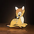 Front view of Bambi LED lightbox sign glowing on a wooden desk