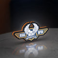 Regal Raptor Motorcycles LED lightbox standing on a desk from an angled side view with orange glow