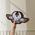 Unlit Regal Raptor Motorcycles LED lightbox held by hand to show size and details