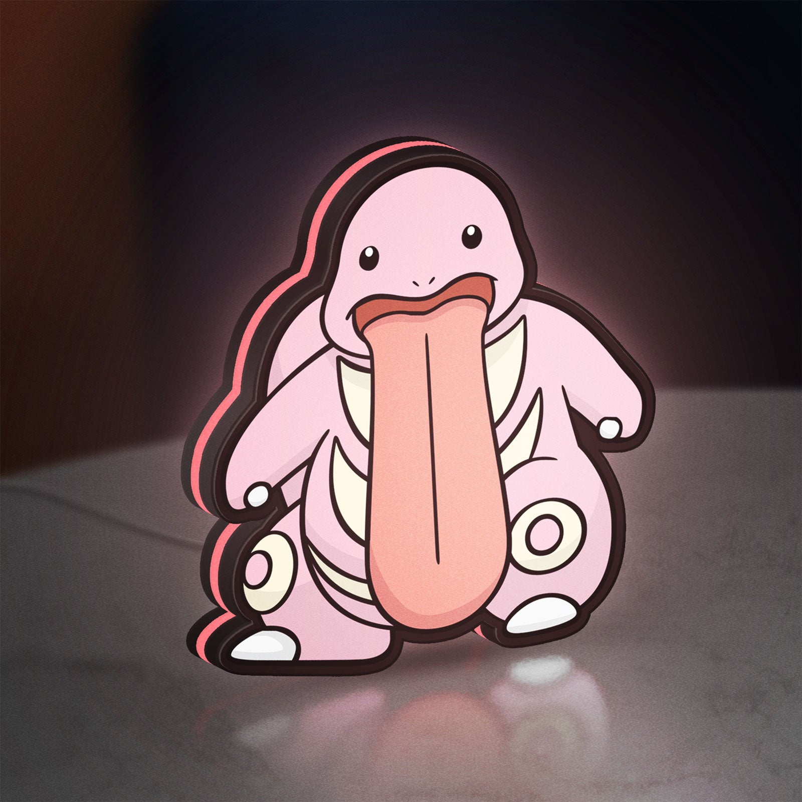 Lickitung LED lightbox standing on a desk from an angled side view with pink glow