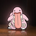 Front view of Lickitung LED lightbox sign glowing on a wooden desk