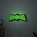 Green Lantern LED lightbox hanging on a wall with green glow