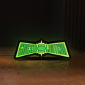 Front view of Green Lantern LED lightbox sign glowing on a wooden desk