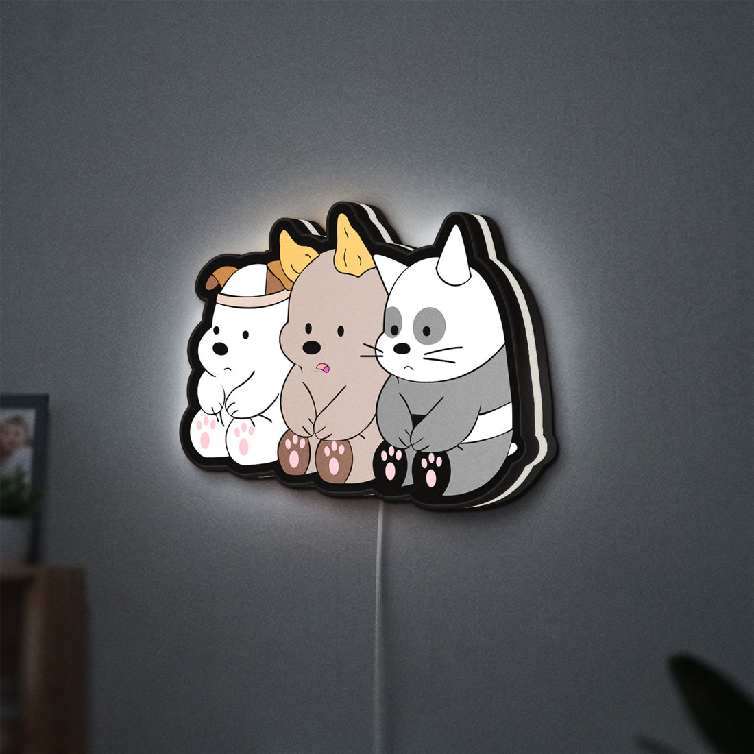 We Bare Bears LED lightbox hanging on a wall with white glow