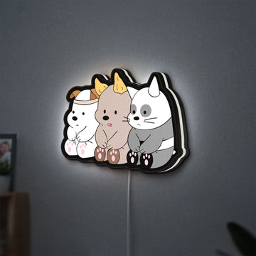We Bare Bears LED lightbox hanging on a wall with white glow