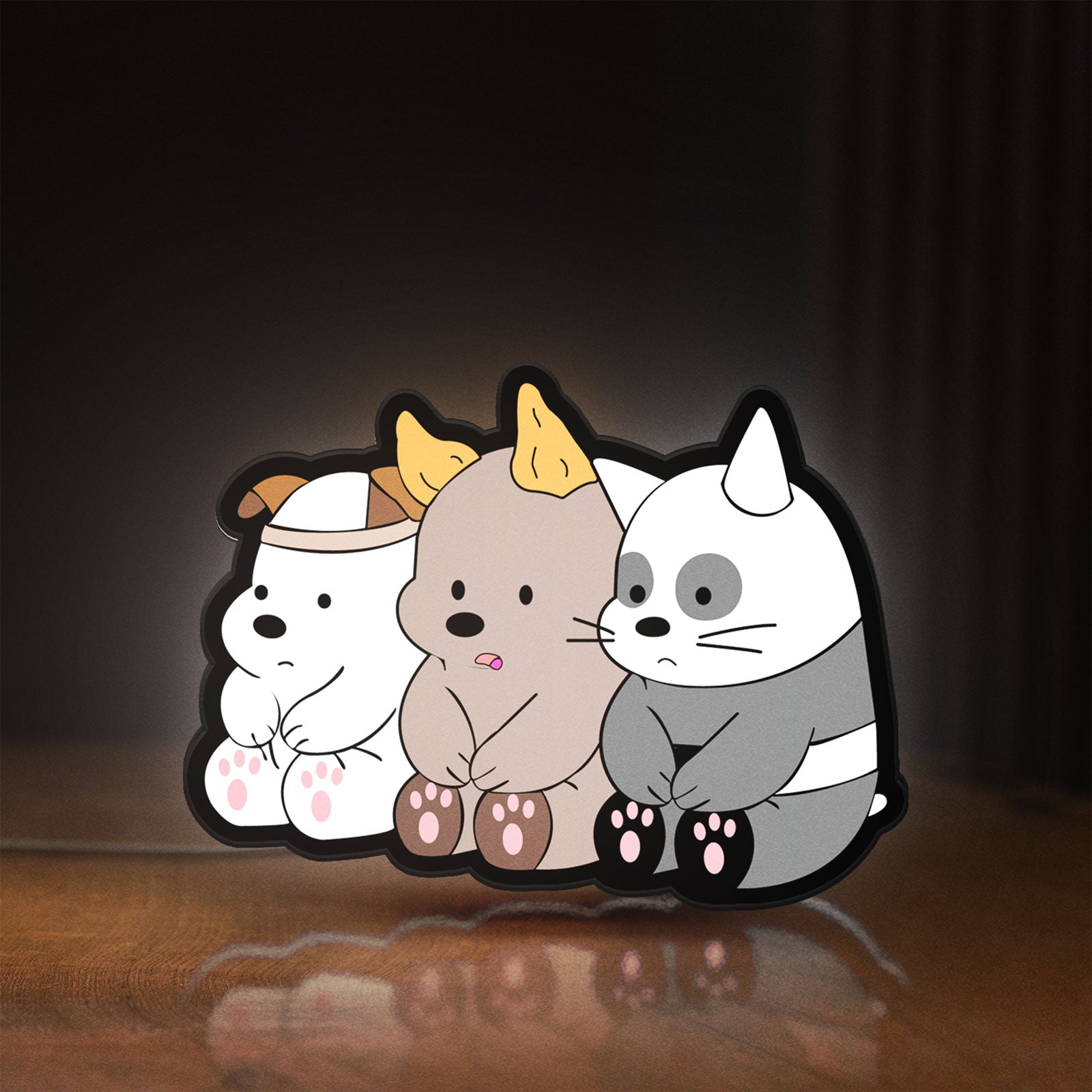 Front view of We Bare Bears LED lightbox sign glowing on a wooden desk