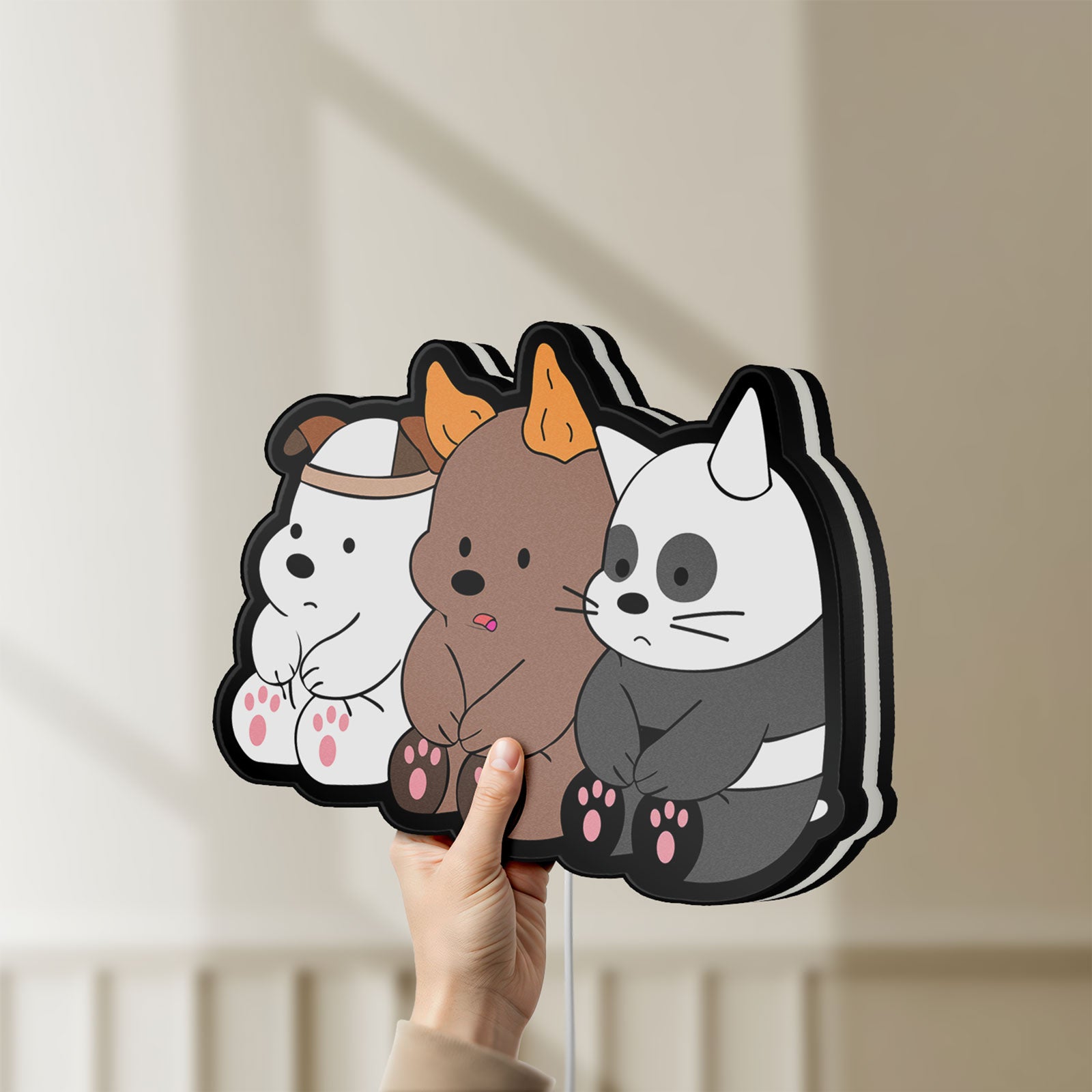 Unlit We Bare Bears LED lightbox held by hand to show size and details