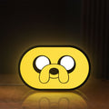 Front view of Adventure Time Jake LED lightbox sign glowing on a wooden desk