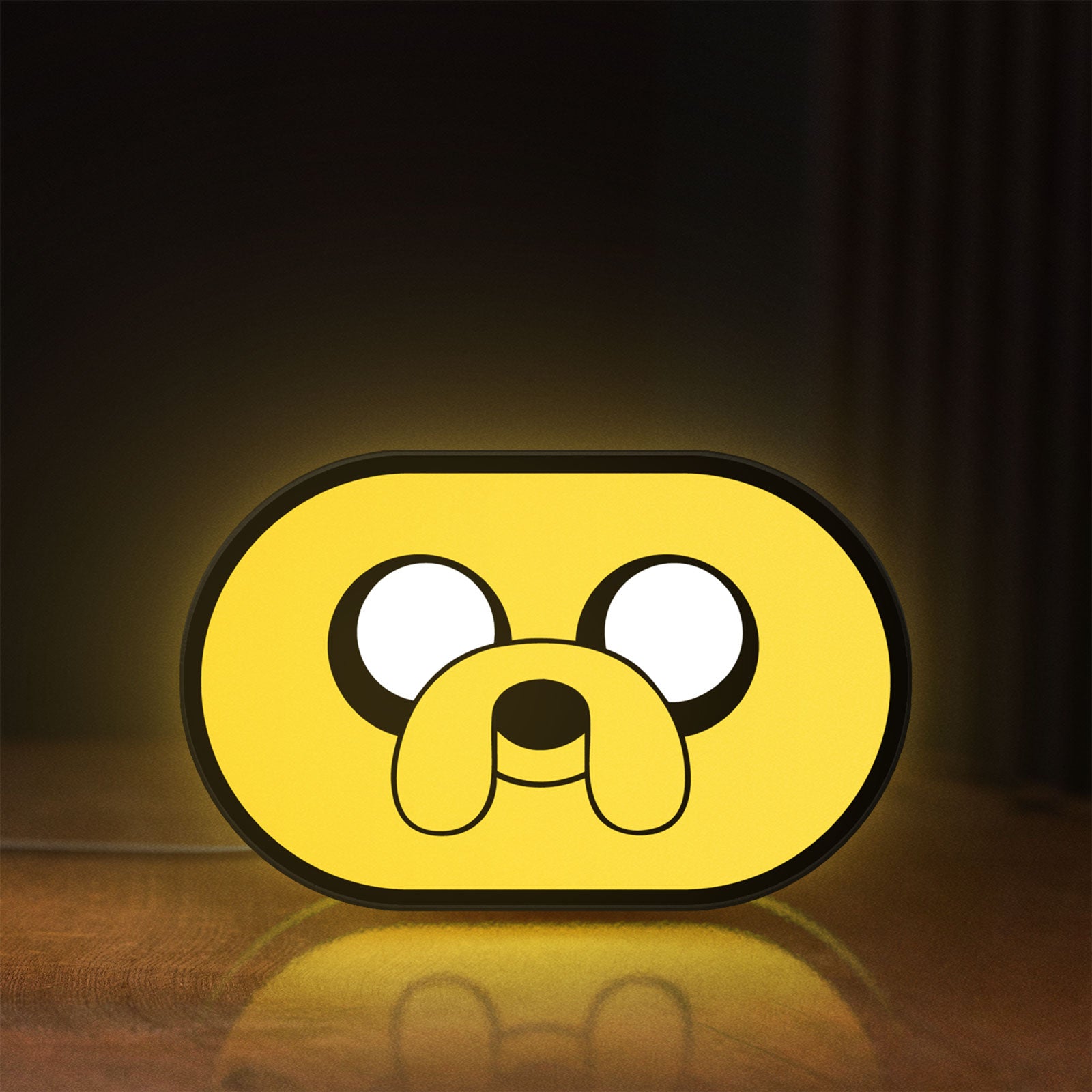 Front view of Adventure Time Jake LED lightbox sign glowing on a wooden desk