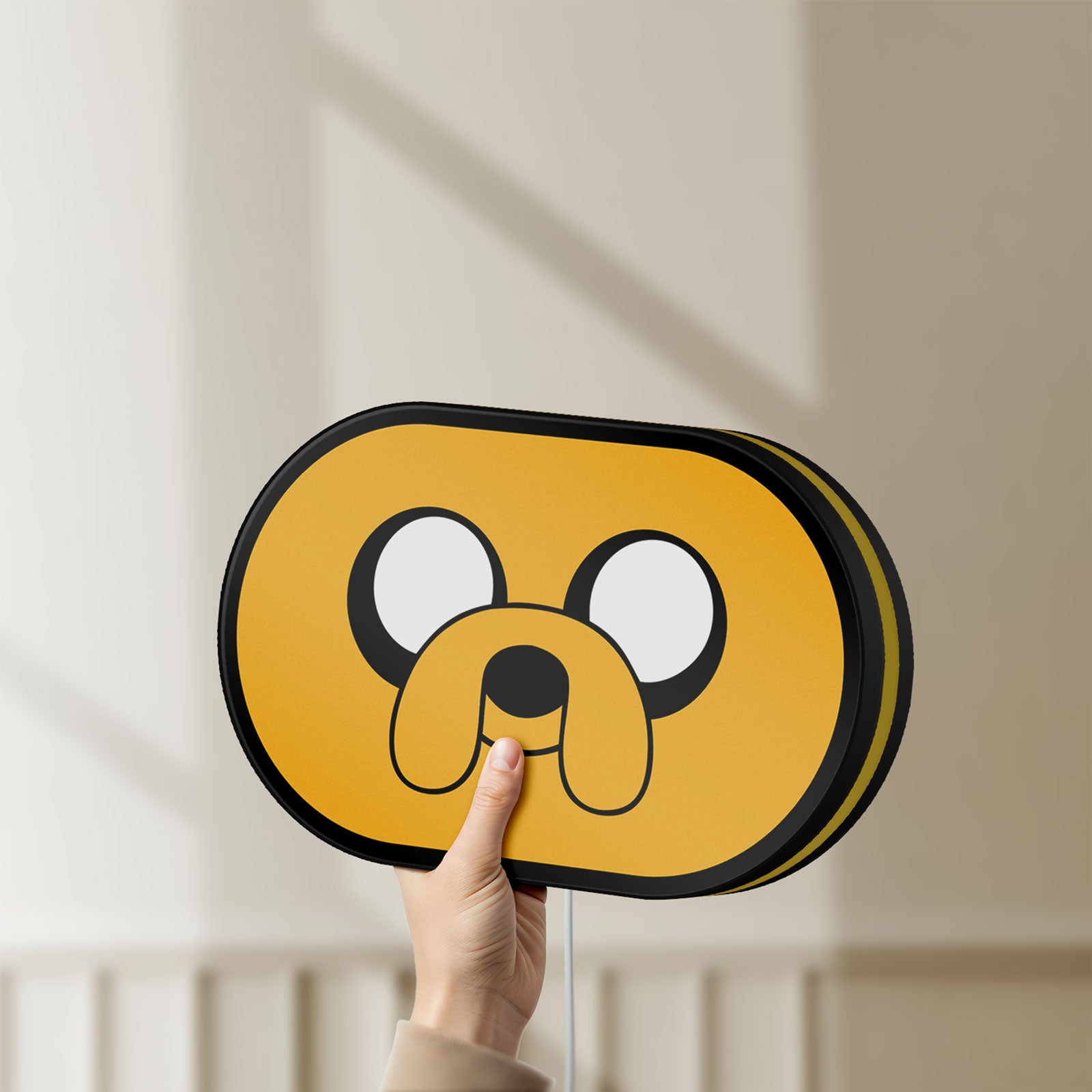 Unlit Adventure Time Jake LED lightbox held by hand to show size and details