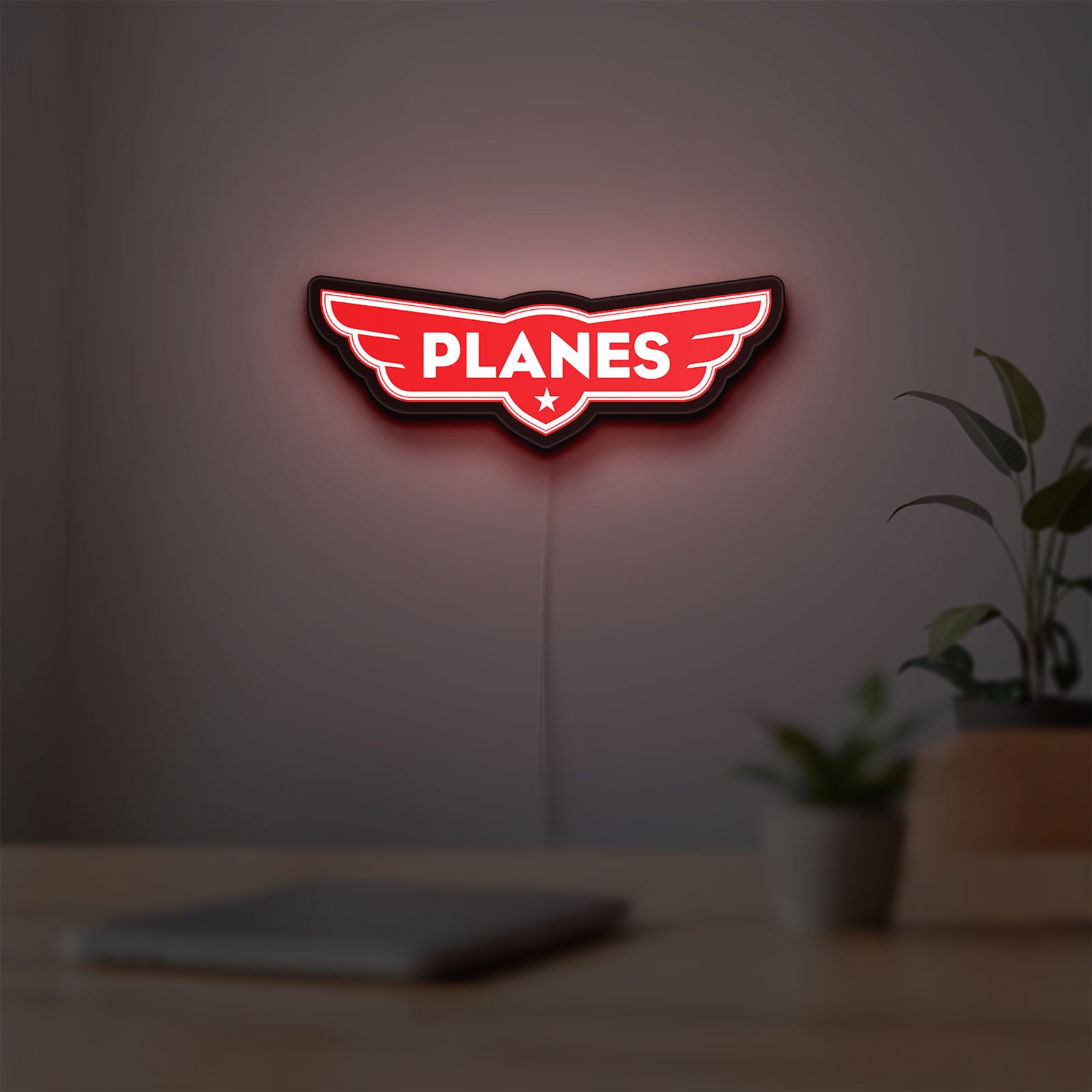 Disney Planes LED lightbox hanging on a room wall with soft red light