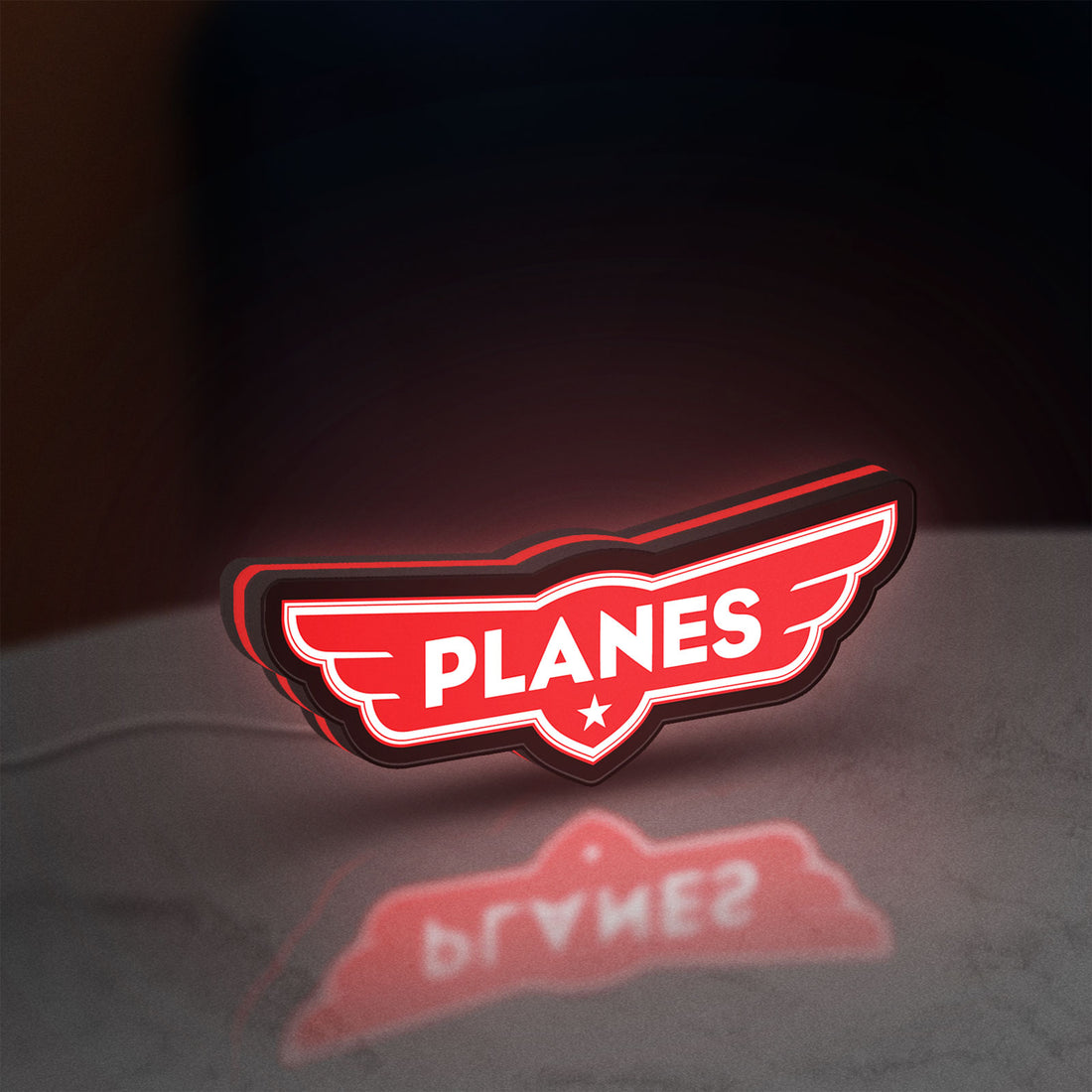 Disney Planes LED lightbox hanging on a wall with red glow