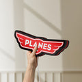 Unlit Disney Planes LED lightbox held by hand to show size and details