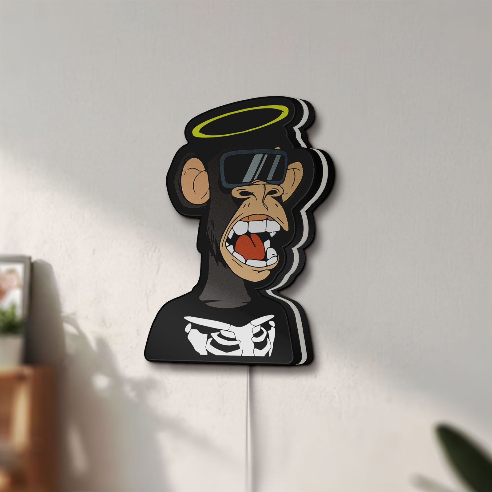 Unlit Bored Ape NFT LED lightbox mounted on a wall in daylight