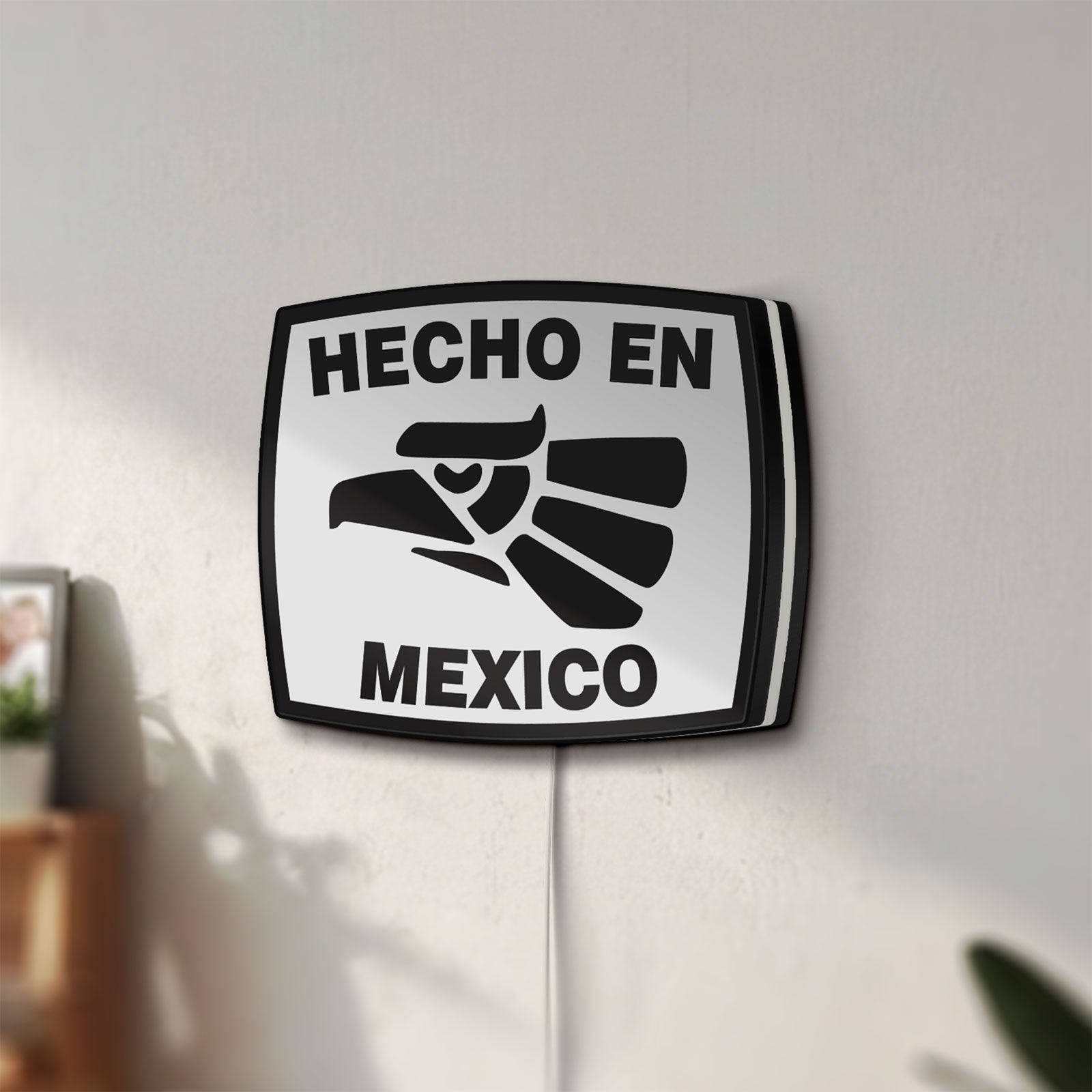 Unlit Hecho en Mexico LED lightbox mounted on a wall in daylight