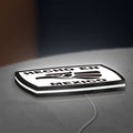 Hecho en Mexico LED lightbox lying flat on a desk with white glow