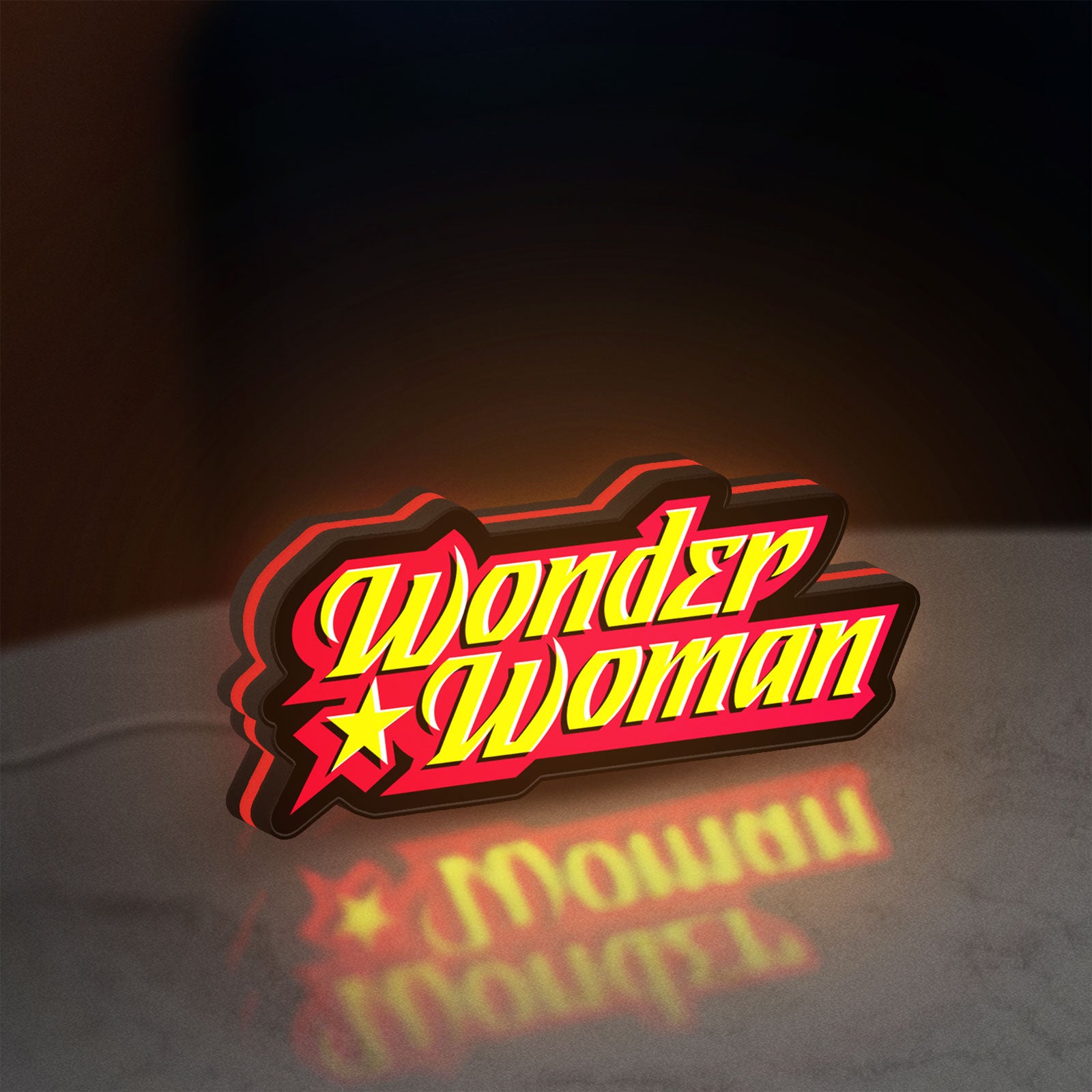 Wonder Woman LED lightbox standing on a desk from an angled side view with red glow