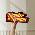 Unlit Wonder Woman LED lightbox held by hand to show size and details