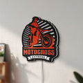 Unlit Motocross LED lightbox mounted on a wall in daylight