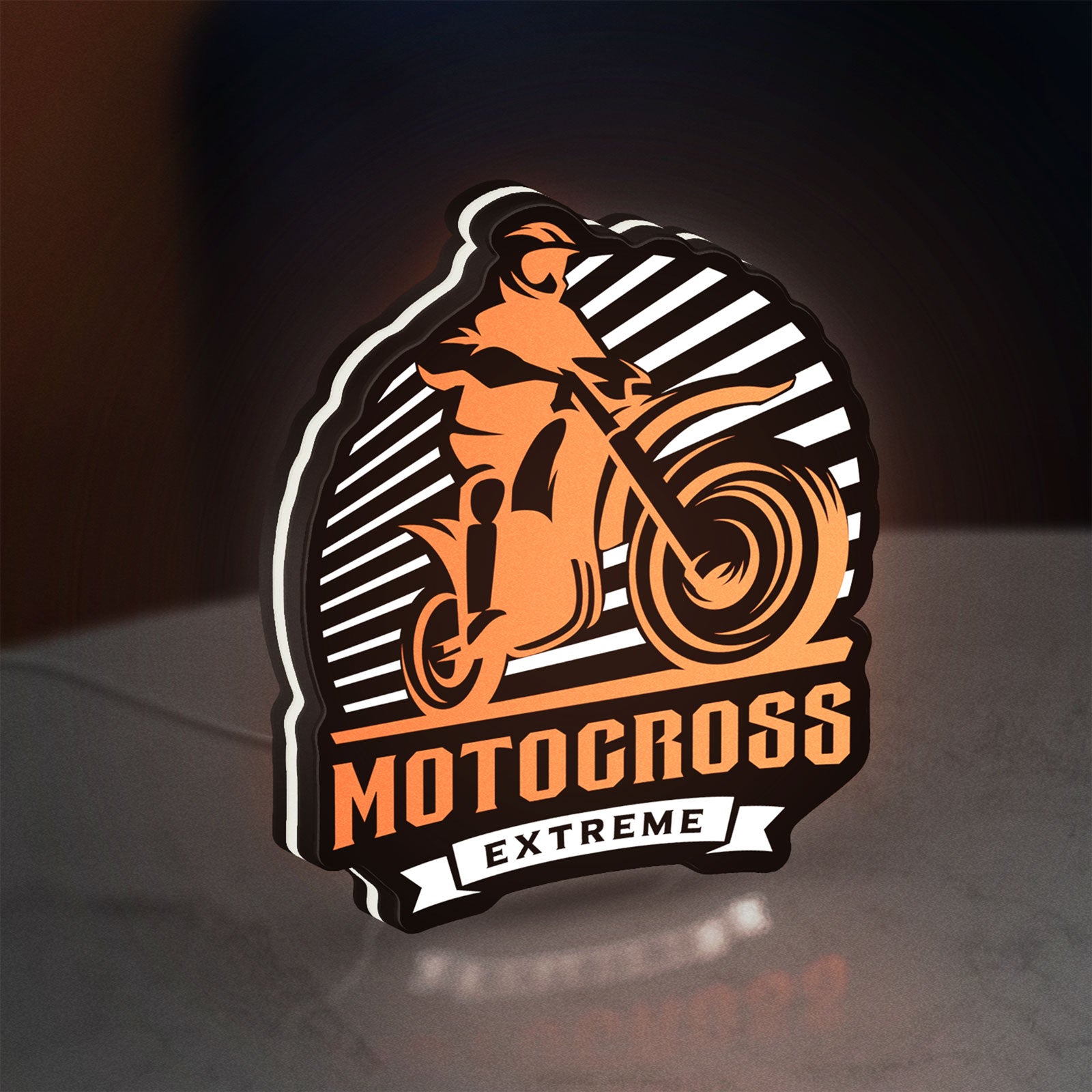 Motocross LED lightbox standing on a desk from an angled side view with white glow