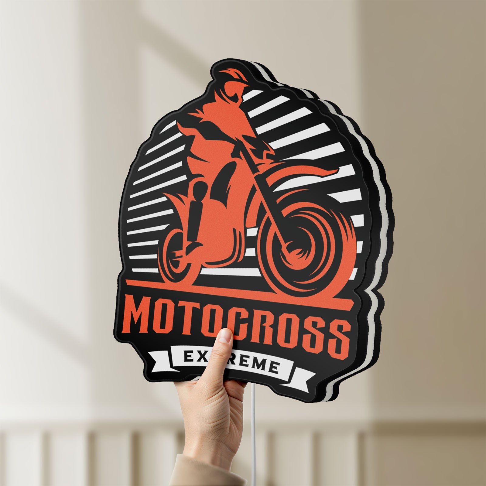 Unlit Motocross LED lightbox held by hand to show size and details