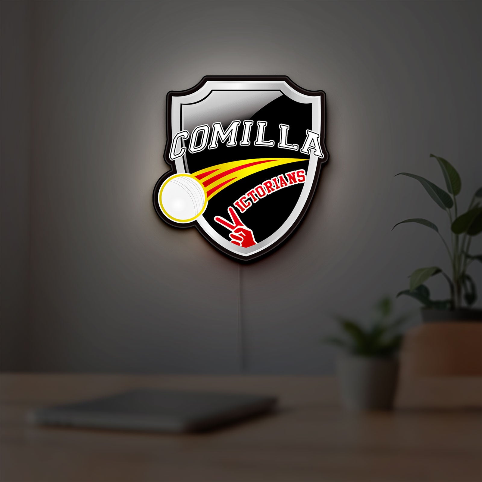 Comilla Victorians LED lightbox hanging on a room wall with soft white light