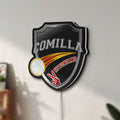 Unlit Comilla Victorians LED lightbox mounted on a wall in daylight