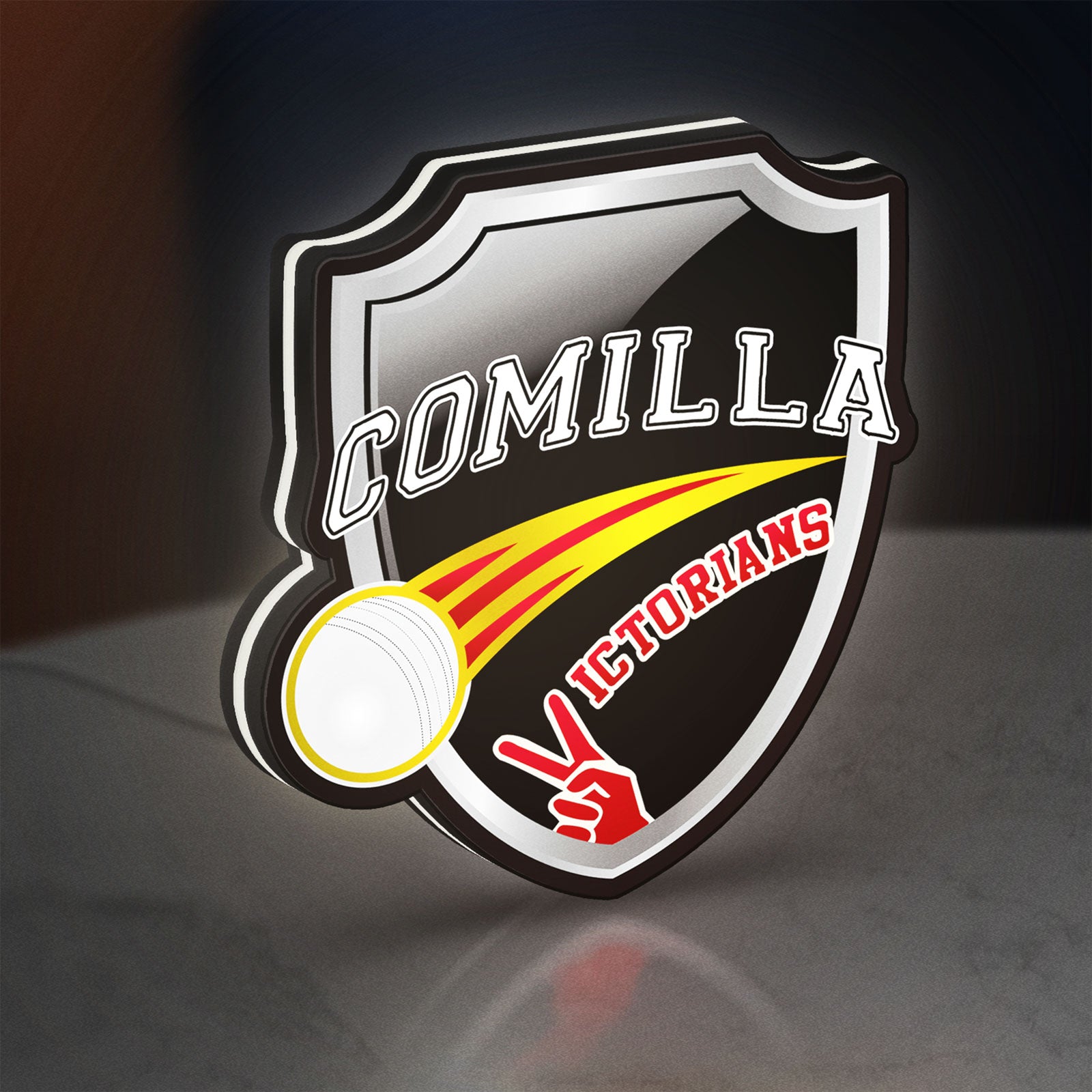 Comilla Victorians LED lightbox standing on a desk from an angled side view with white glow