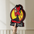 Unlit Lucky Devil LED lightbox held by hand to show size and details