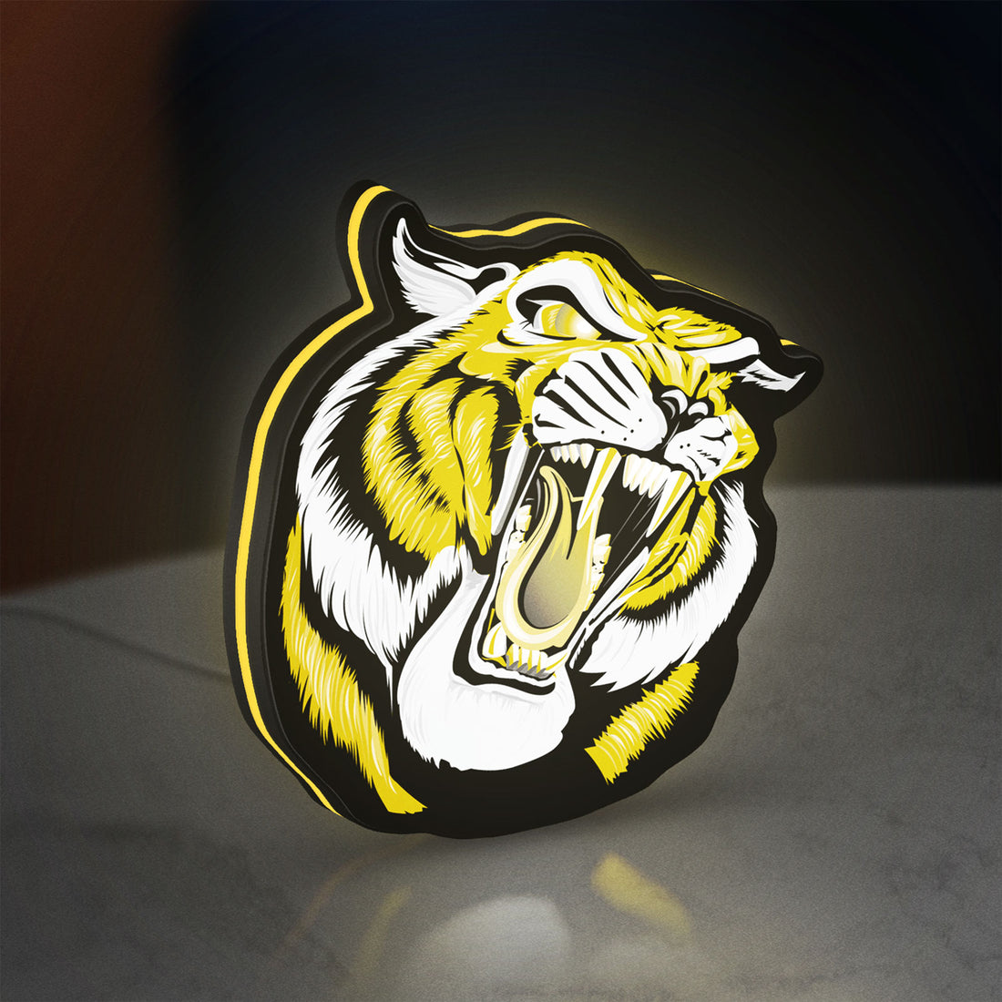 Tiger LED lightbox hanging on a wall with yellow glow