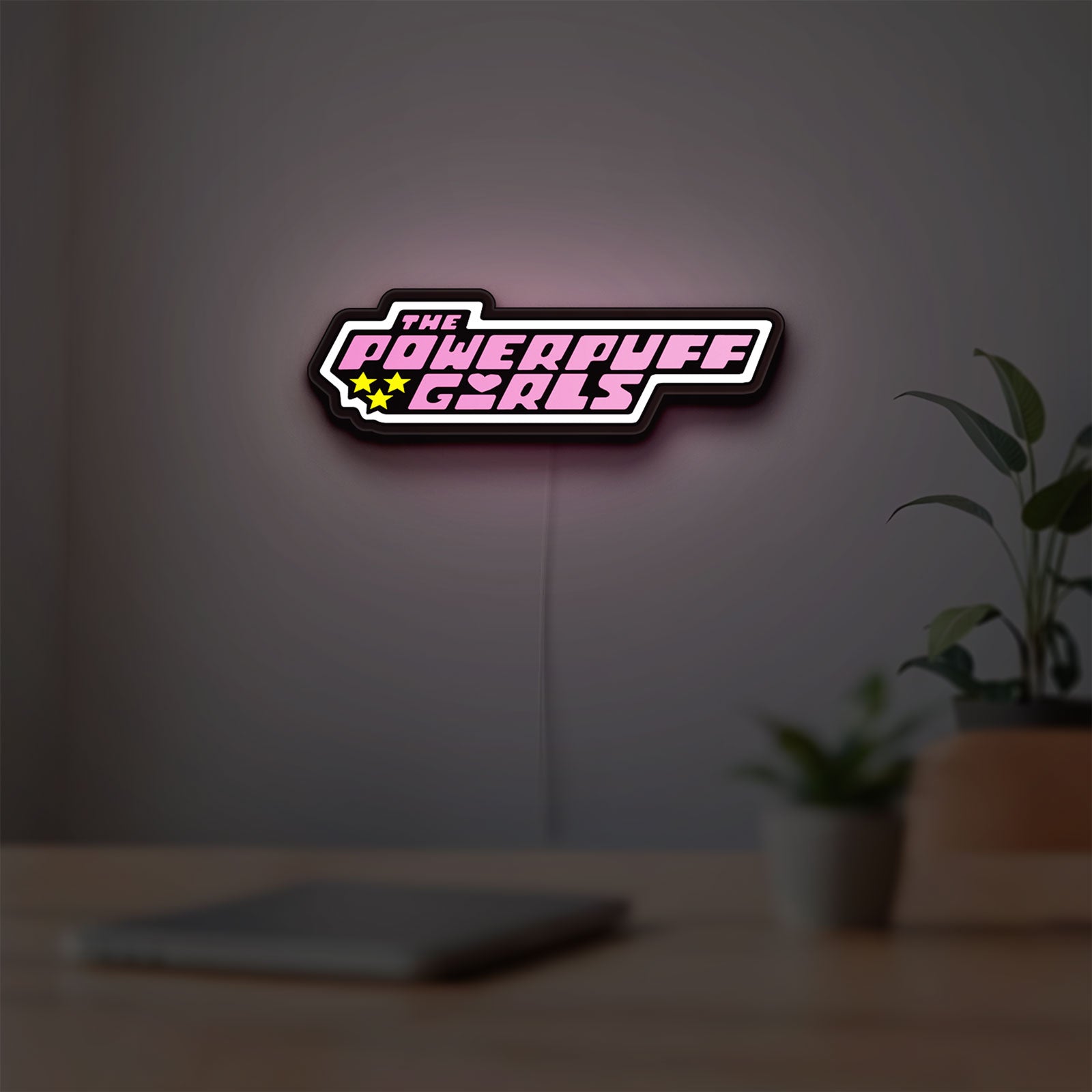Power Puff Girls LED lightbox hanging on a room wall with soft pink light