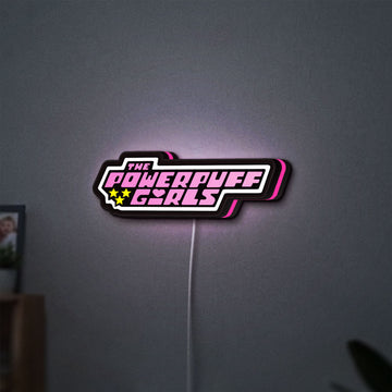 Power Puff Girls LED lightbox hanging on a wall with pink glow