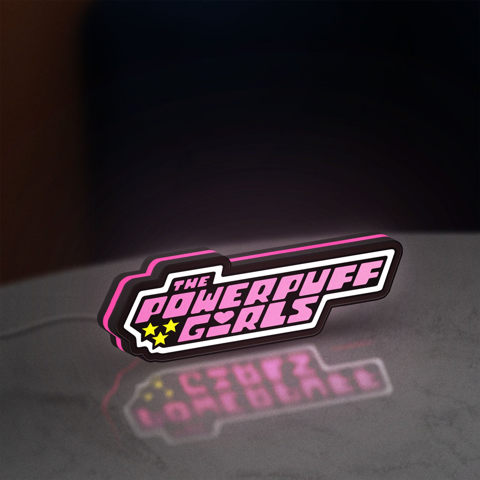 Power Puff Girls LED lightbox standing on a desk from an angled side view with pink glow
