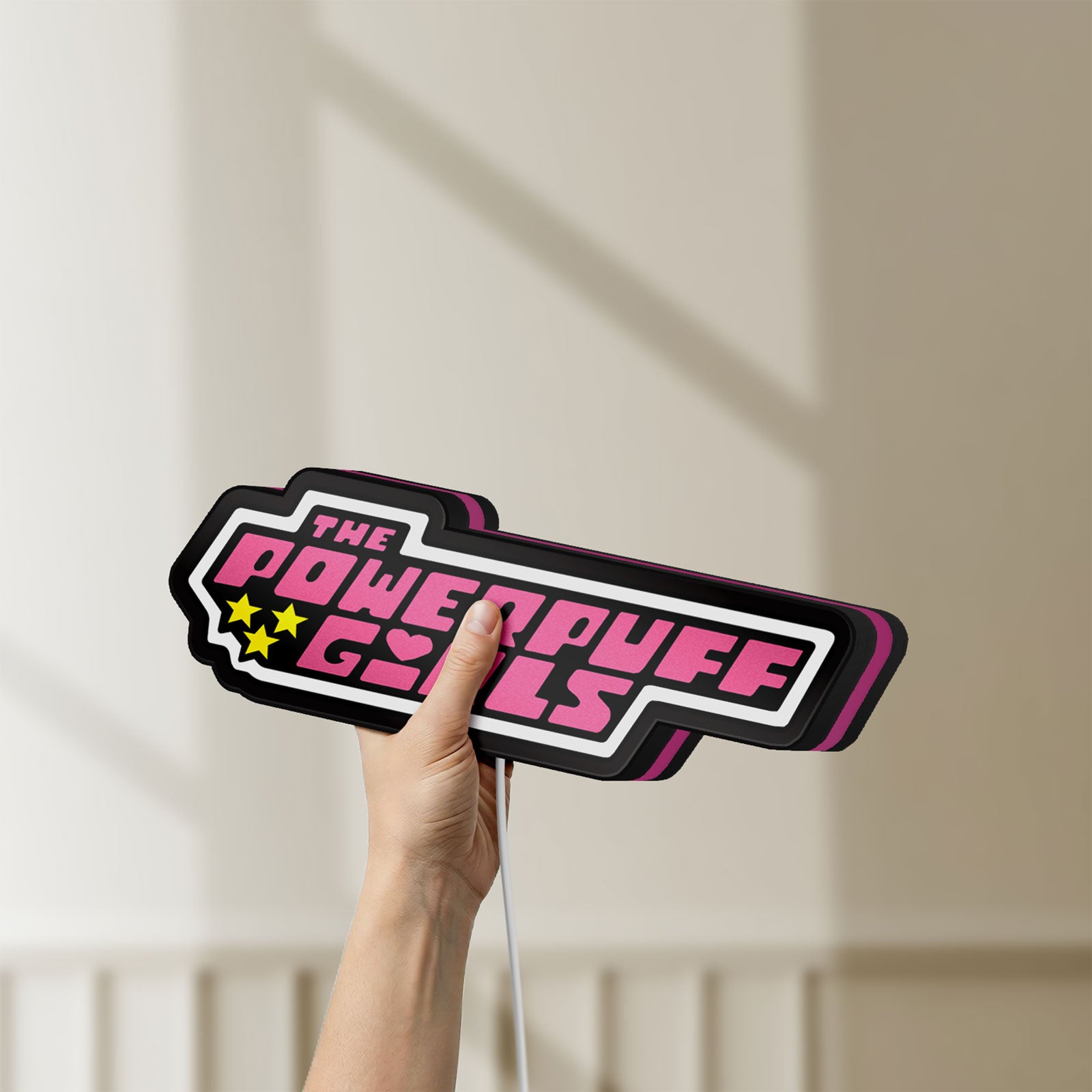 Unlit Power Puff Girls LED lightbox held by hand to show size and details