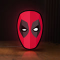 Front view of Deadpool Head LED lightbox sign glowing on a wooden desk