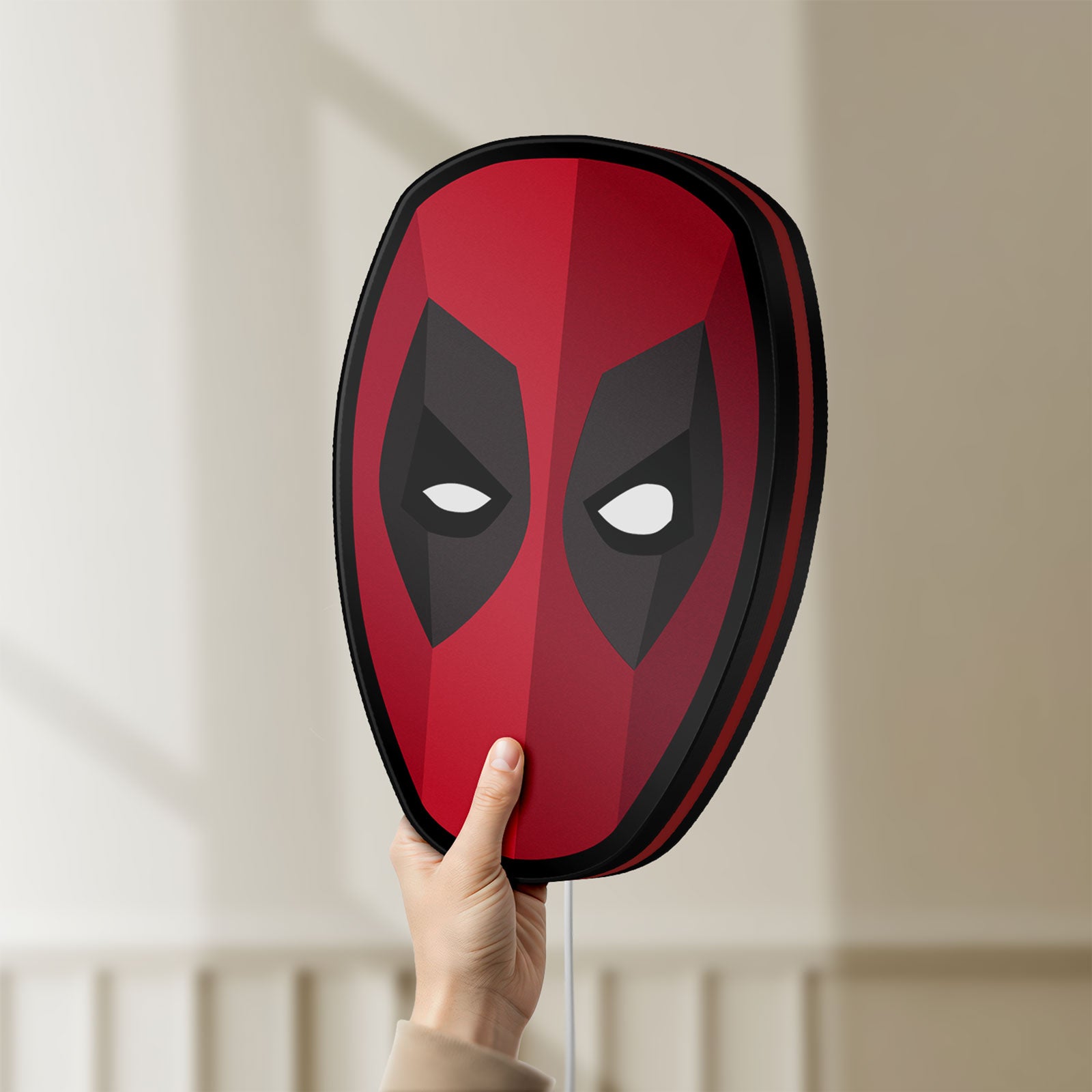 Unlit Deadpool Head LED lightbox held by hand to show size and details