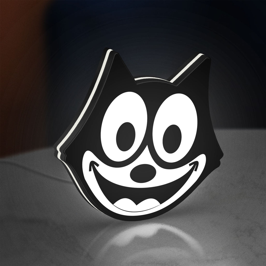 Felix the Cat LED lightbox hanging on a wall with white glow