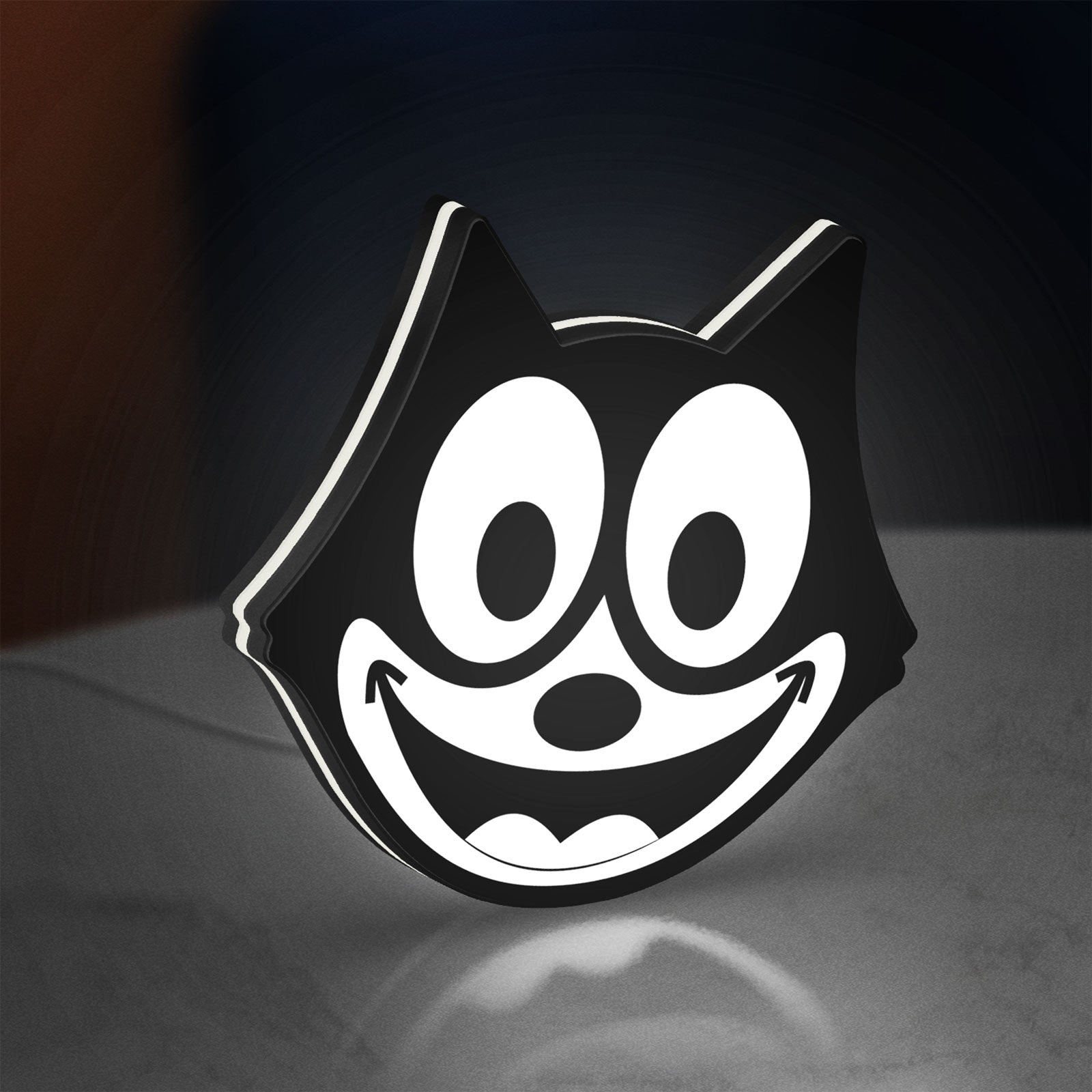 Felix the Cat LED lightbox standing on a desk from an angled side view with white glow