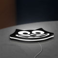 Felix the Cat LED lightbox lying flat on a desk with white glow