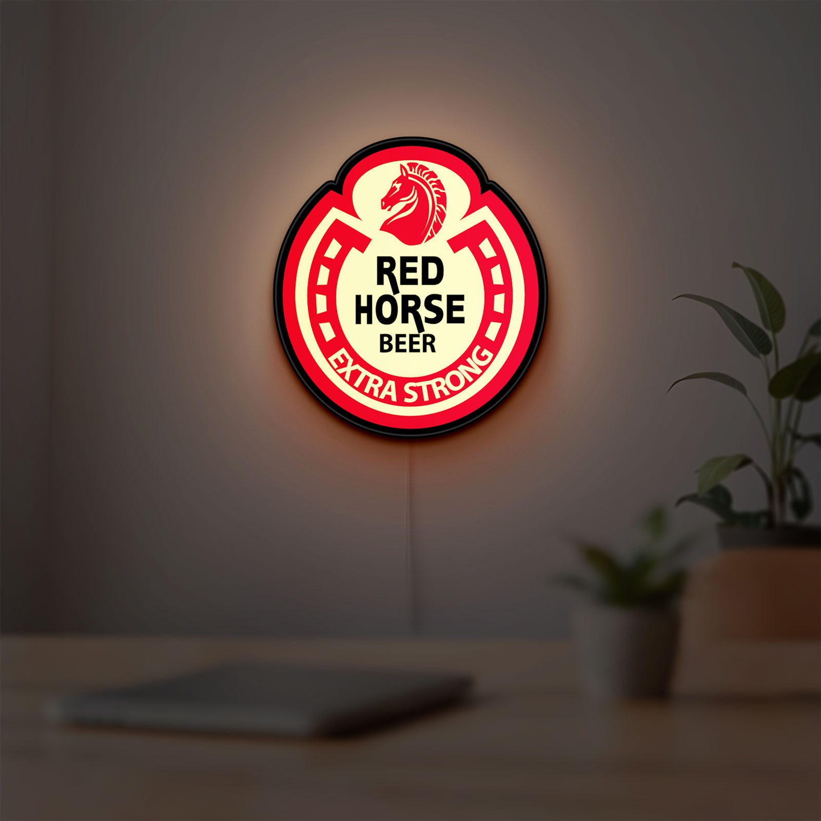 Red Horse Beer LED lightbox hanging on a room wall with soft red light